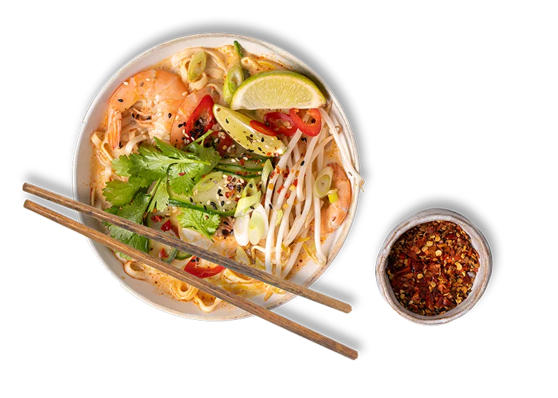 Noodles in a curry broth with prawns and herbs