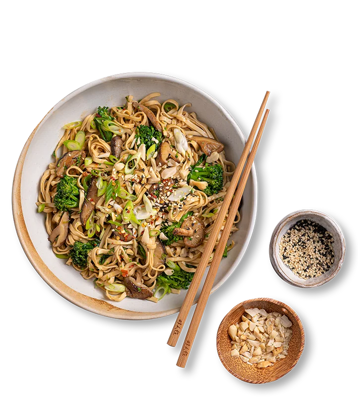Noodles stir-fried with mushrooms and greens